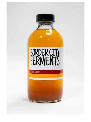 bottle of Fermented tonic, ranging from golden to deep orange