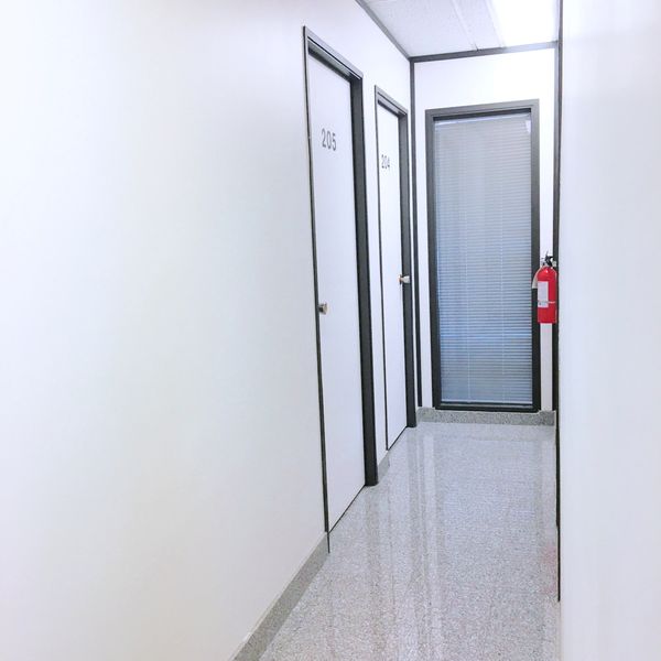Luxurious granite flooring on hallways. office for rent at Wright Business Centre, Calgary SE