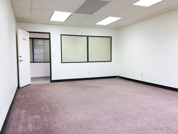 Bright clean office for rent in Calgary SE, at Wright Business Centre. Window to inside hallway.