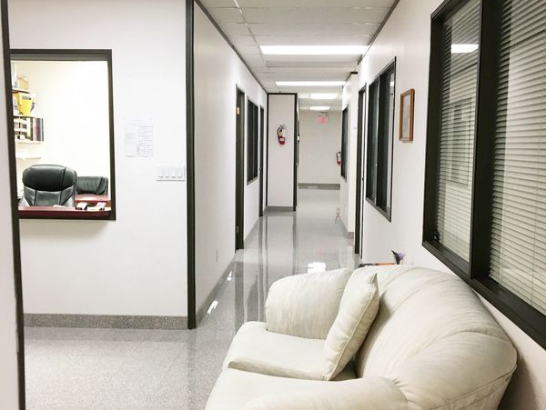 Clean, well-maintained granite flooring hallway at Wright Business Centre, Calgary SE, Alberta