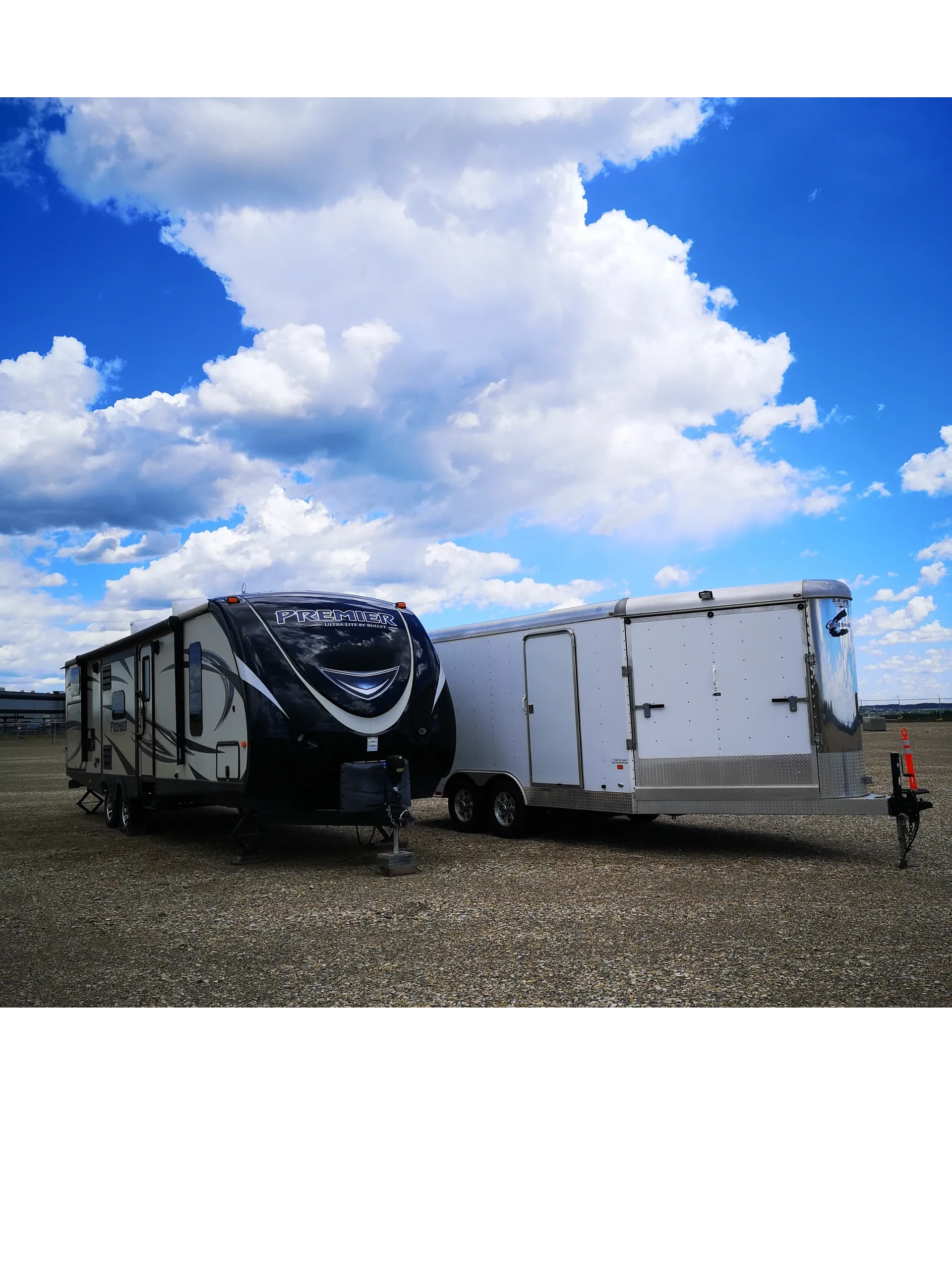 Holiday Trailer and enclosed trailer being parked and stored in an outdoor storage facility