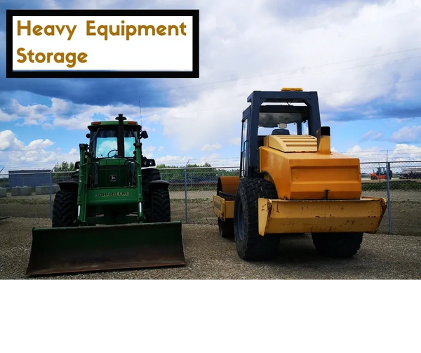 Tractor and equipment parked and stored in an outdoor lot