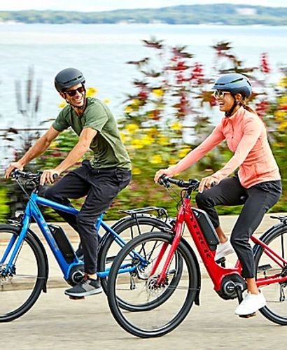 Couple having fun while riding Bosch electric bikes rented at "Bike Rental Tenerife" in Costa Adeje.