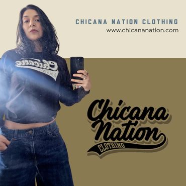 A woman wearing a black Chicana Nation long sleeve