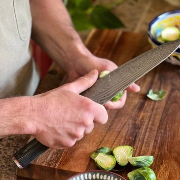 Chef Matt preparing Brussel sprouts for a dinner in Breck