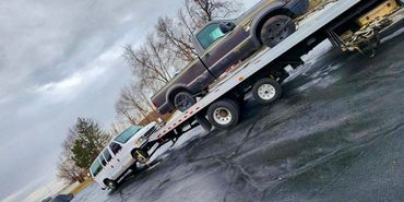 Tow truck towing broken down vehicles