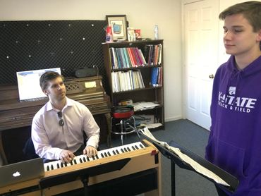 James Myers working with a voice student in his studio