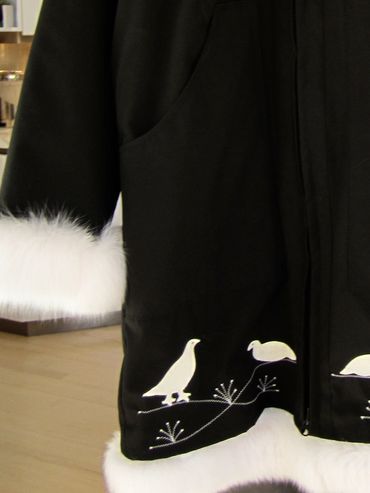 This jacket  with extra fur around the bottom has minimal decoration, no rickrack (the wavy ribbon p