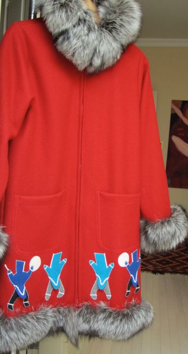 Each of these figures is cut by hand for the jacket. The parkas in this applique are three dimension