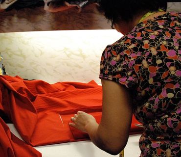 Every custom parka is hand cut. Here is a seamstress at work.