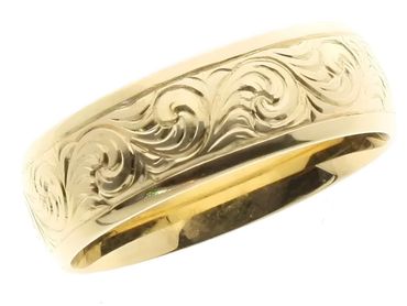 Wide engraved gold band.