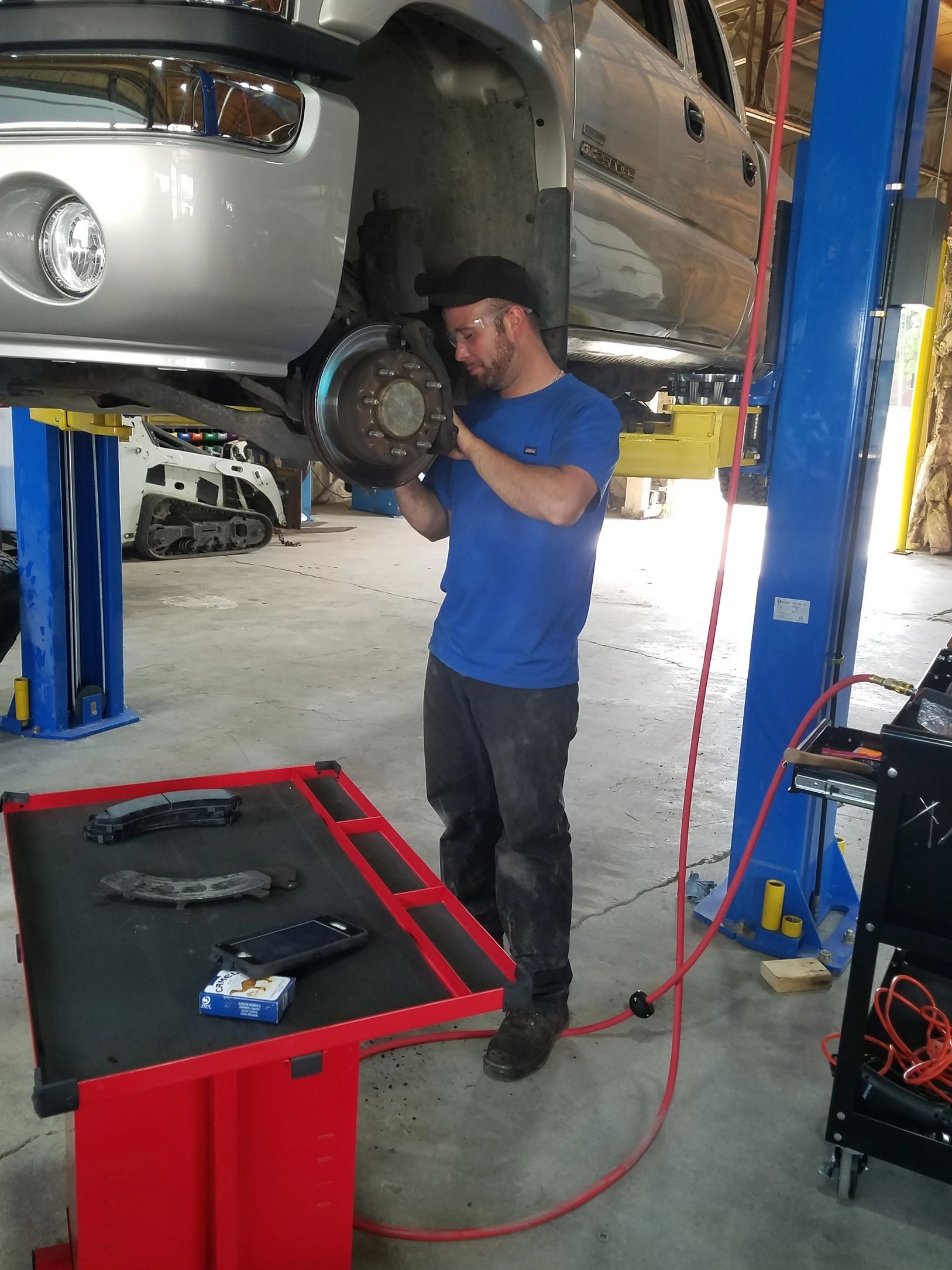 Customer replacing brake pads on his vehicle 