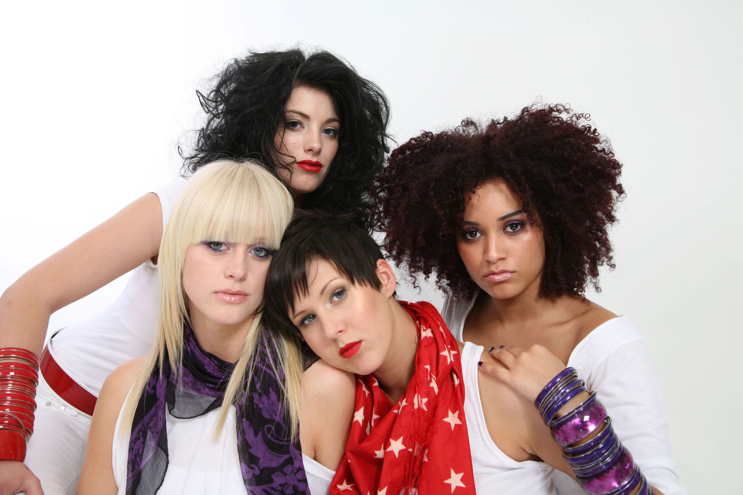 four women wearing makeup