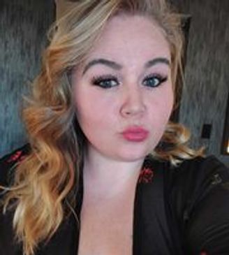 a woman with blonde wavy hair