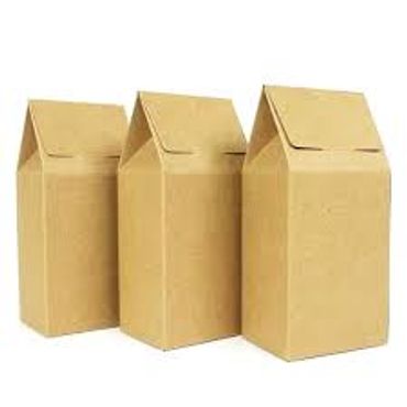 Three plain brown cardboard milk cartons standing upright.