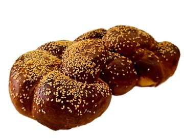 Fresh baked sesame challah, soft inside, golden crust. Authentic Israeli bakery flavor.