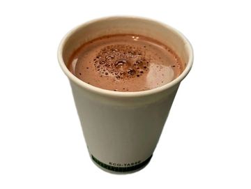 Rich hot chocolate in eco cup, creamy, smooth, and perfectly crafted for cozy moments.