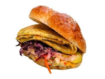 Fresh challah omelet sandwich in Winnipeg with slaw, pickles and tahini. Made fresh daily.