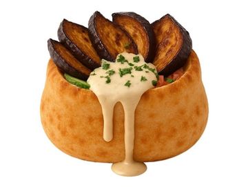 Fried eggplant in fluffy Middle Eastern pita, topped with creamy tahini, herbs, and fresh veggies