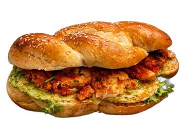 Shakshuka in fresh challah. Baked eggs, rich tomato sauce, herbs. Authentic Israeli flavor.