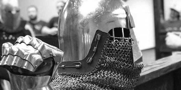 Close-up of medieval knight armor and gauntlet.