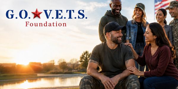 Group of veterans enjoying a sunset by the water with G.O.V.E.T.S. Foundation logo.