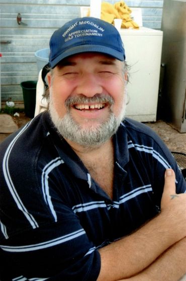 A happy man wearing a cap