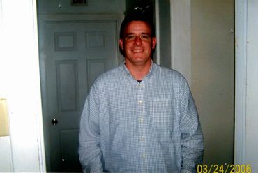 A man wearing a long sleeve polo