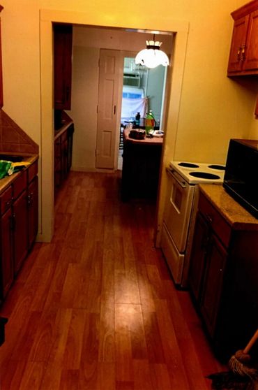 A kitchen and a small room