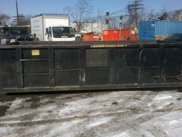 15 yard roll off dumpster being used for a roofing rpoject