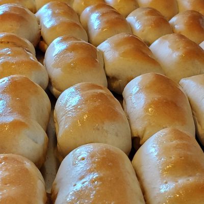 Freshly baked soft golden rolls.
