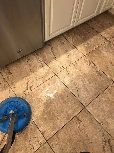 Brown dirty tiles being cleaned