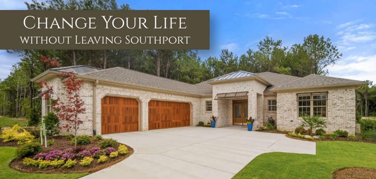 Modern house with wooden garage doors and a landscaped front yard.