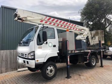 White Isuzu tree care truck with elevated work platform.