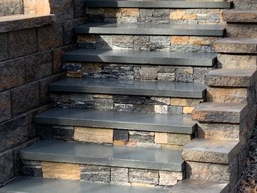 Home restoration with stone veneer steps.