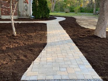 Intricate pathway design with accessibility in mind. Custom pathway with natural pavers.