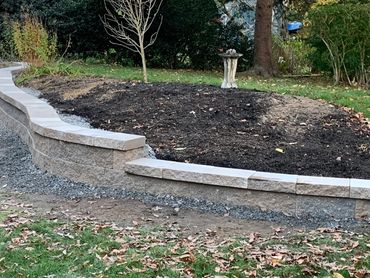 Terraced retaining wall with natural stone.