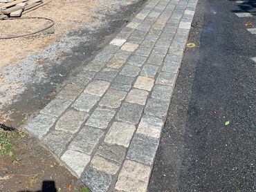 Expert installation of cobblestone apron