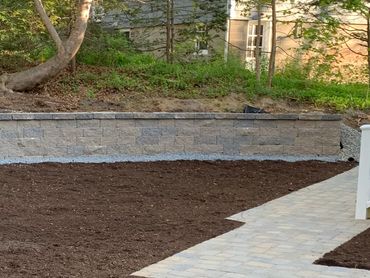 Gorgeous stone retaining wall.