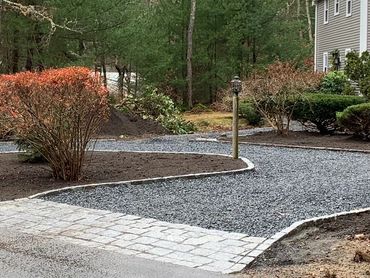 Beautiful scenic driveway with newly installed cobbleston apron.