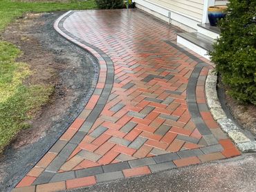 Timeless and classic brick pathway. precise bricklaying expertise.