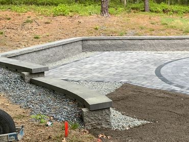 Retaining wall built to expand outdoor space and custom patio.