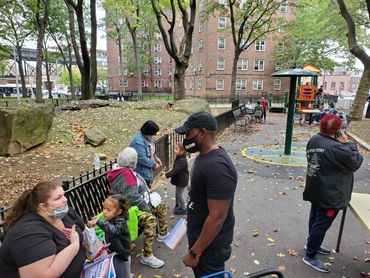 Kevin C Riley speaking to a concern mother in the Bronx.