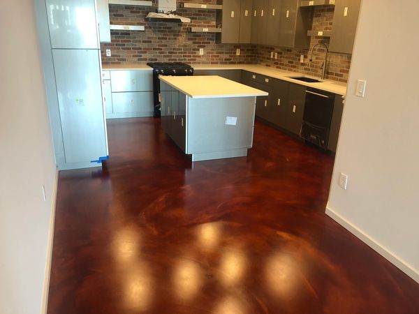 Travis at Katy Trail Uptown Dallas concrete overlay project, Ardex with concrete dyes, matte sealer