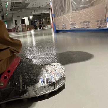 Self leveler going down on rough uneven concrete for Commercial general contractor in Frisco, Texas