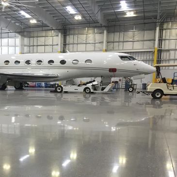 Low maintenance airplane hanger floors, seamless flooring, liquid applied floors, polished concrete