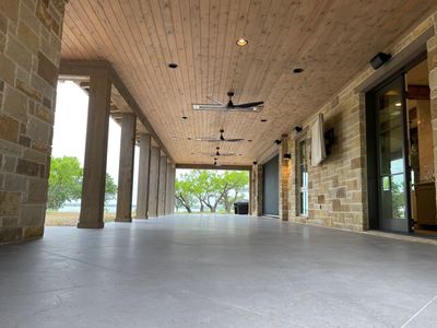 Residential patio with sealed concrete surface, porches, honed and scored for custom builder in TX