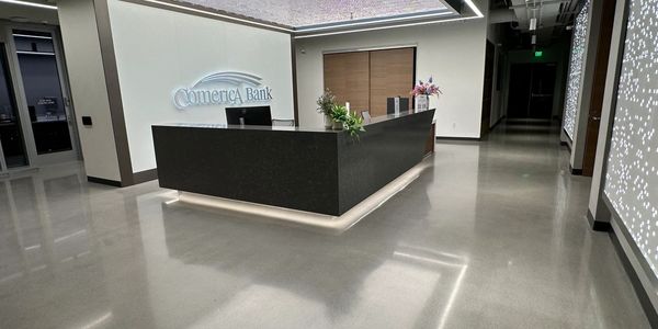 Polished concrete overlays in modern commercial offices at Comerica in frisco, TX general contractor
