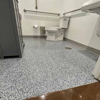 Commercial epoxy, flake flooring for bathrooms, break rooms, and wet areas and retail spaces