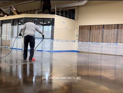 Commercial Metallic Epoxy Flooring with FloorRescue® spraying topcoat coatings before grand opening